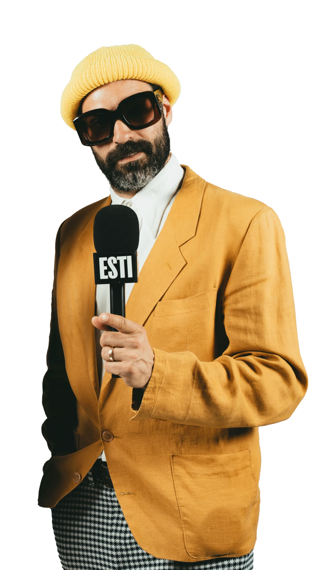 Jules, in a mustard blazer and yellow beanie, holding an ESTI mic